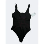 Body modelador feminino com efeito compressor, disponível em preto e branco, ideal para um ajuste perfeito ao corpo.